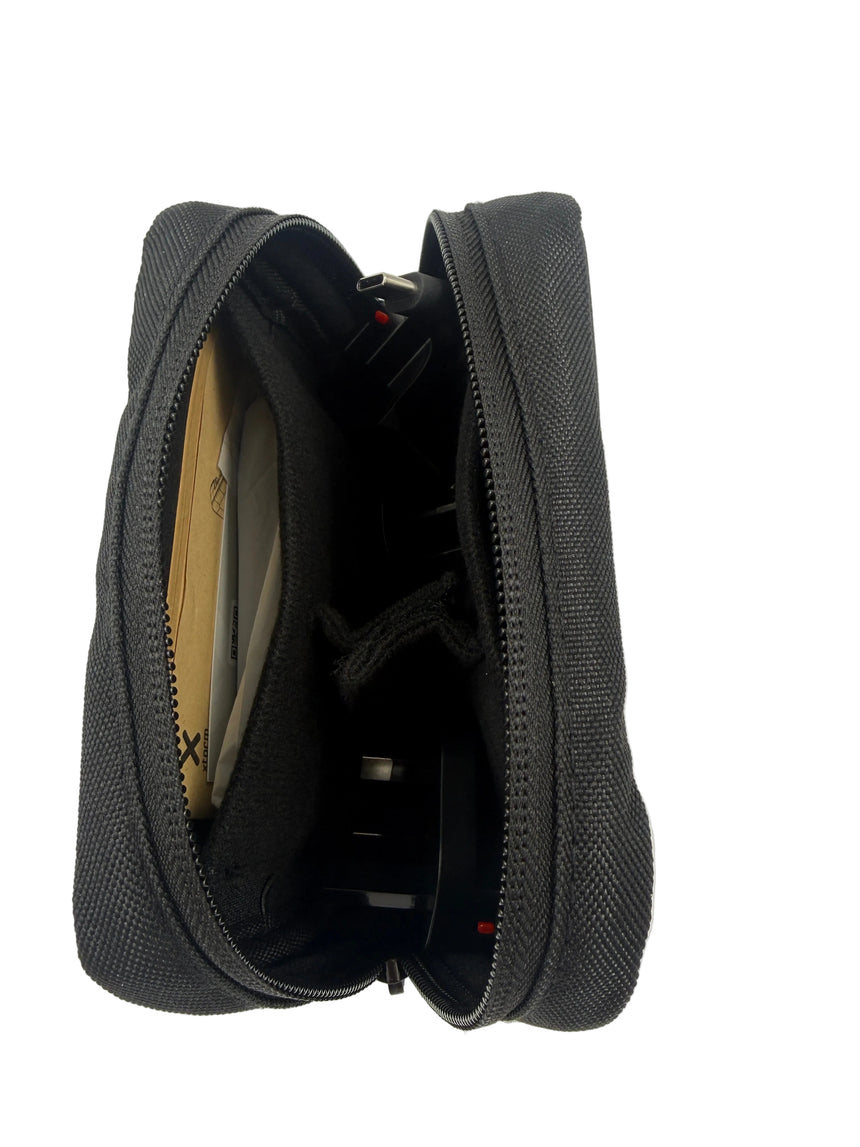 Black zippered pouch with items inside