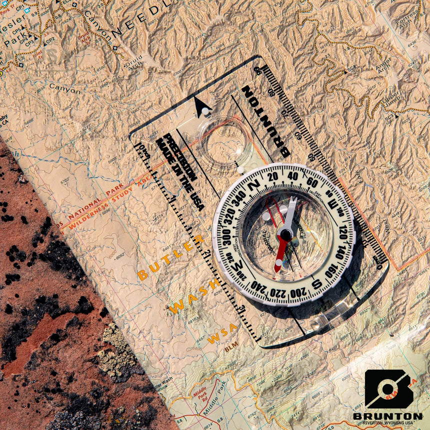 Brunton compass on a topographic map