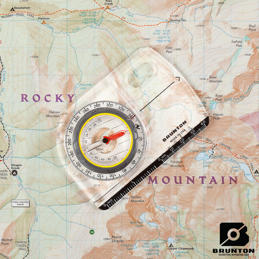 Brunton compass on a topographic map with 'Rocky Mountain' text