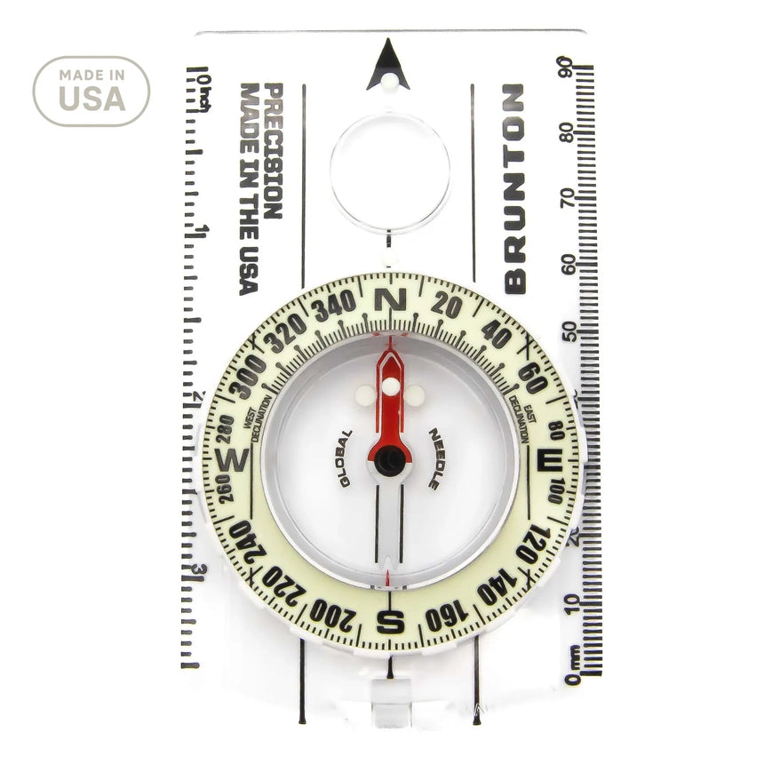 Brunton compass with scale on a white background