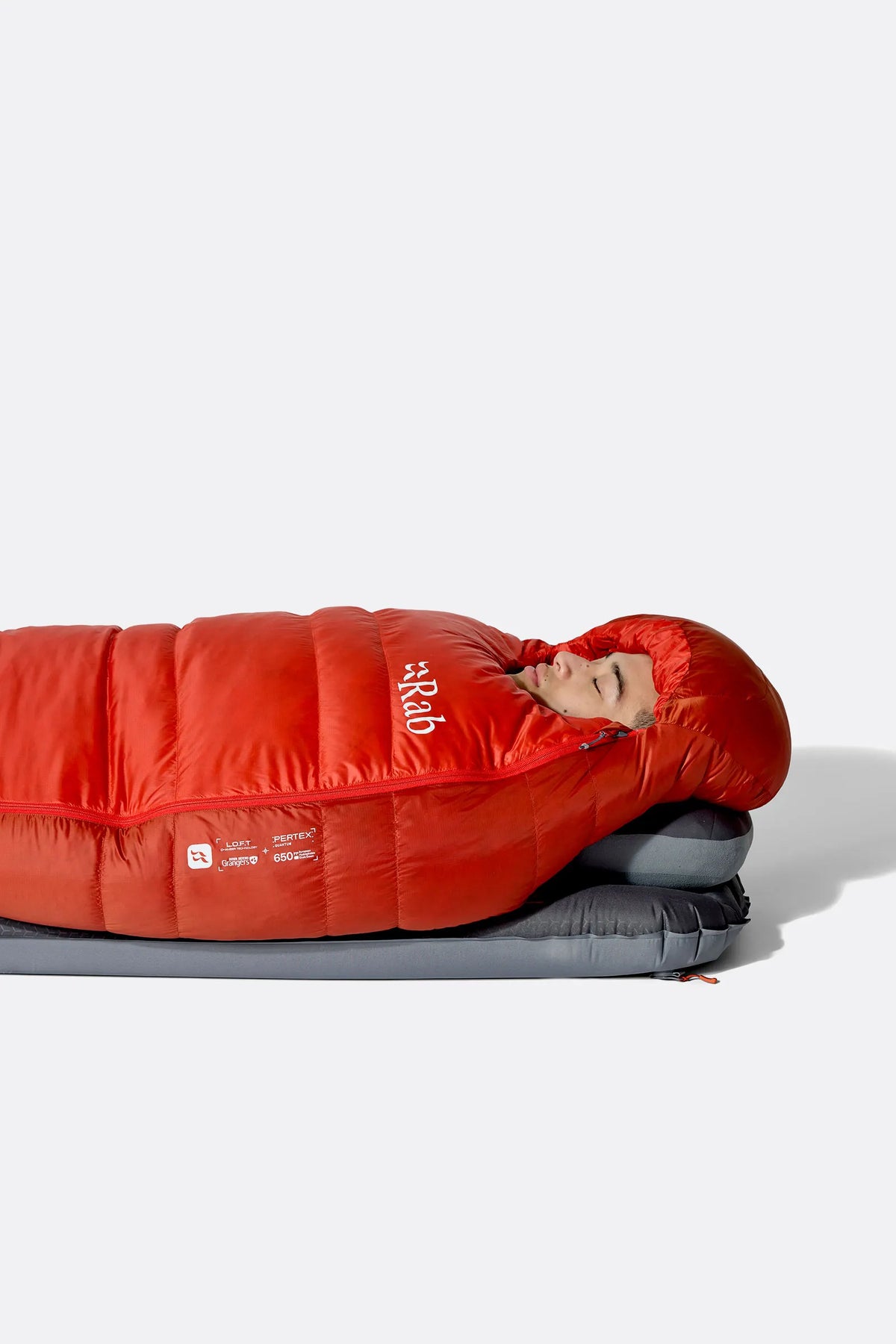 Rab Alpine Down Sleeping Bag (-12°C/10F) in Dark Horizon/Tuscan Red - worn, side sleeping