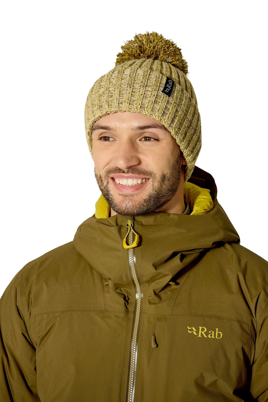 Rab Kharve Bobble Beanie in Dark Pollen/Pebble - worn, front