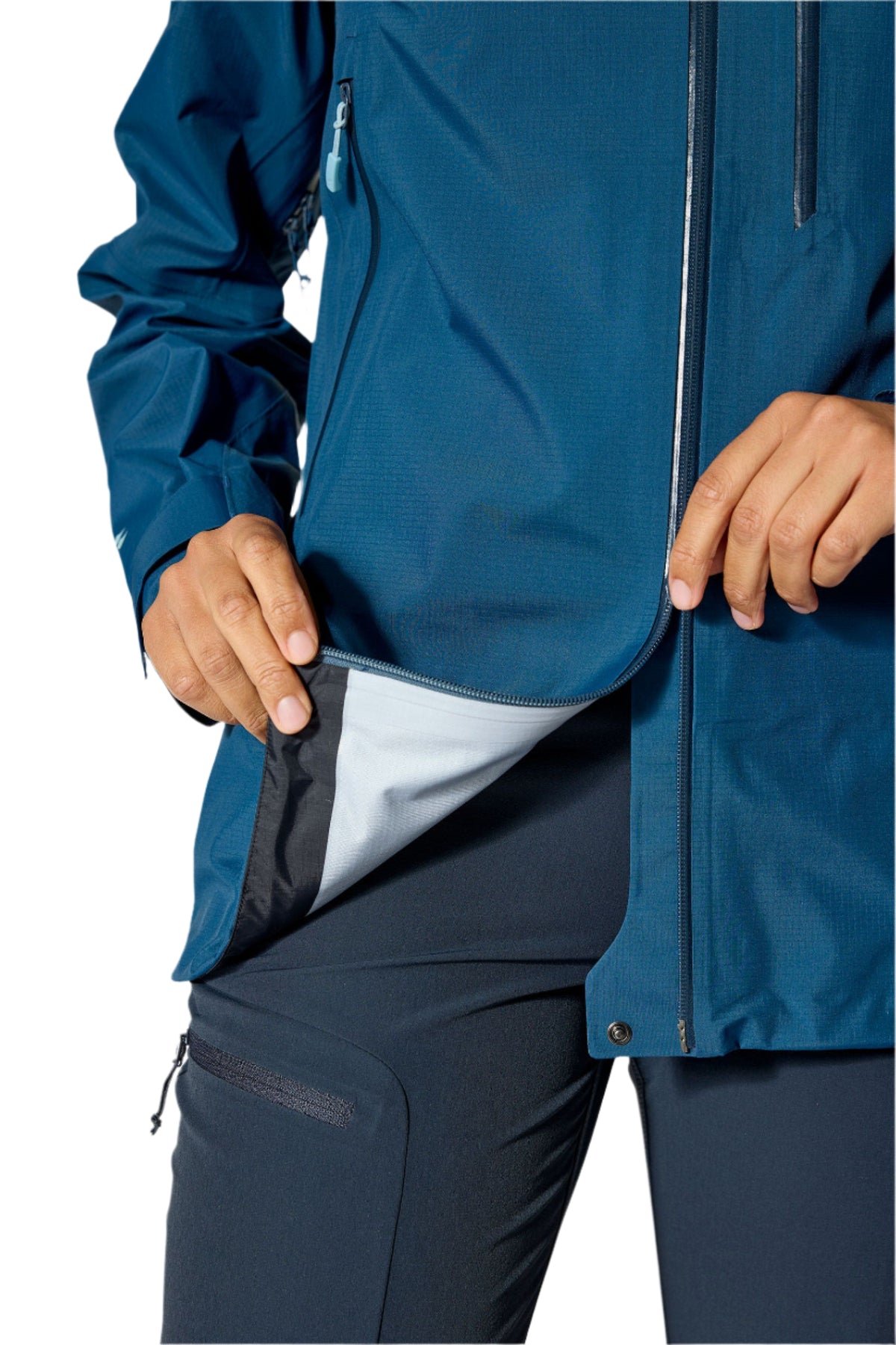 Rab Women's Firewall Mountain Waterproof Jacket in Tempest Blue - hand pocket lining detail, worn