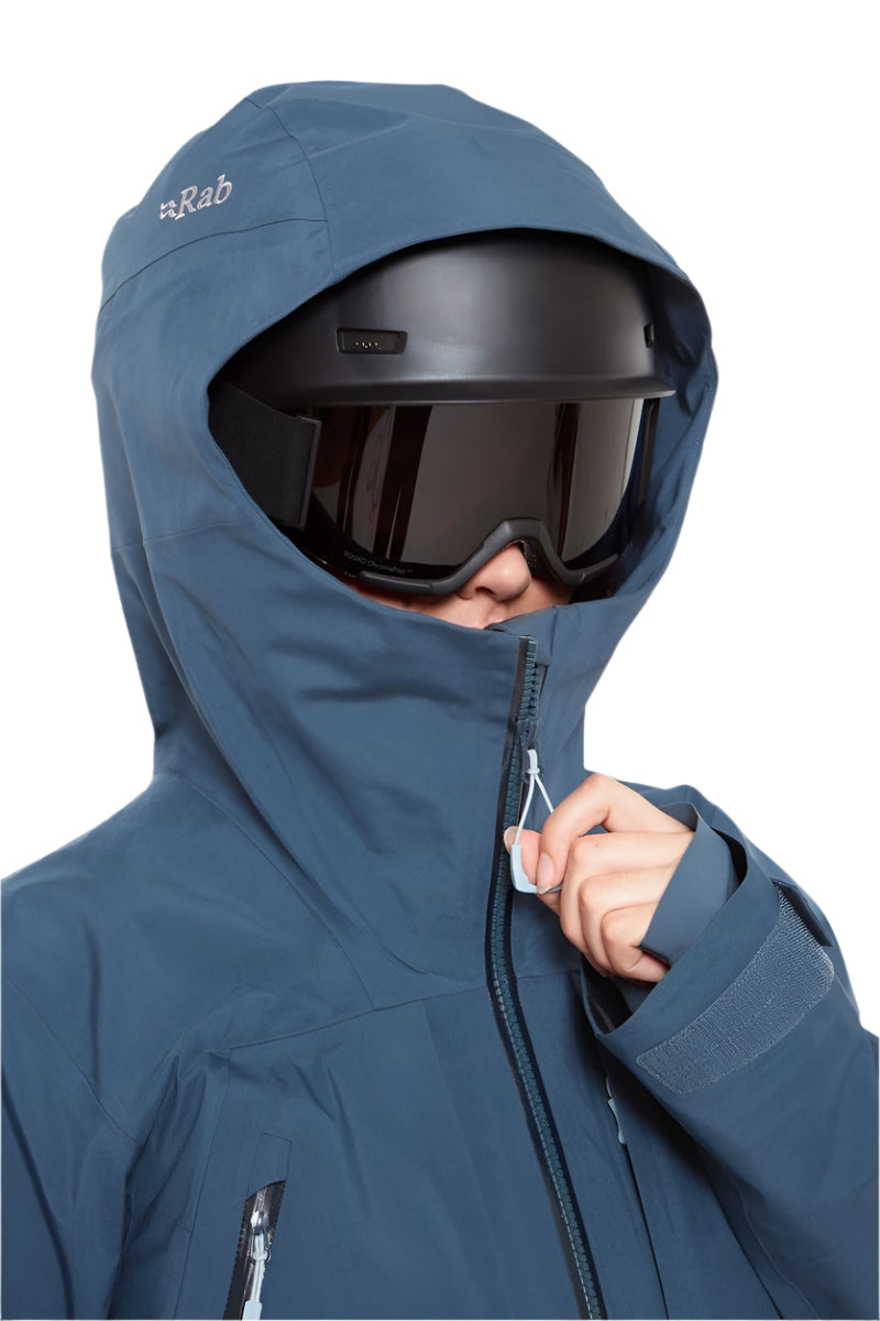 Rab Women's Khroma Converge GORE-TEX Ski Jacket in Tempest Blue - worn with helmet, front (reference only, not a stocked colour)