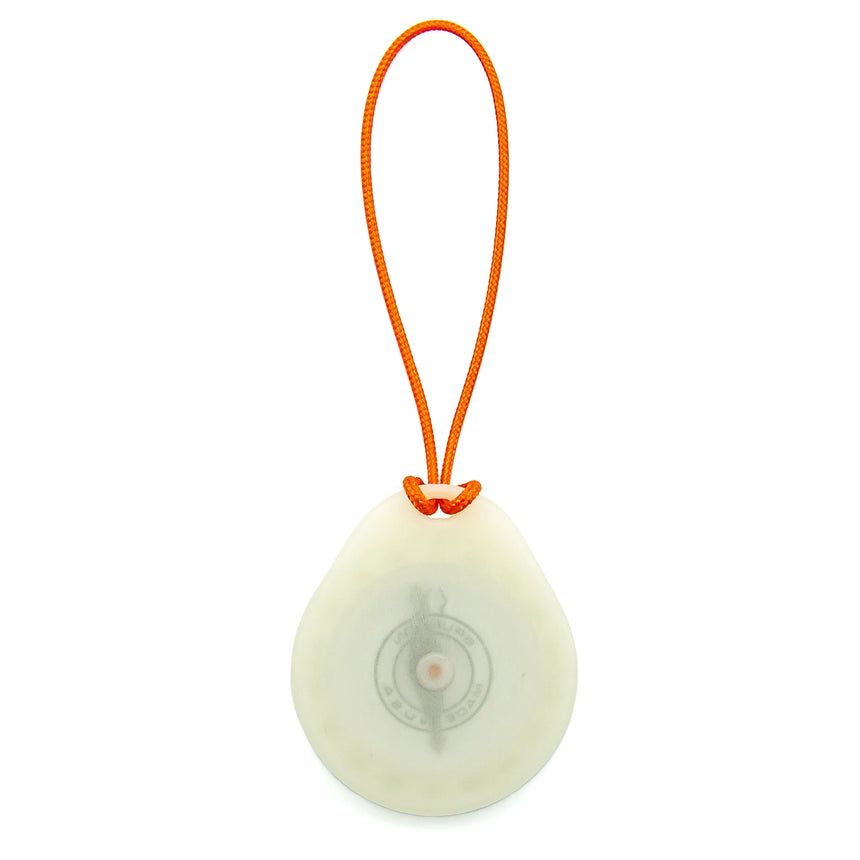 Round white device with an orange strap on a white background