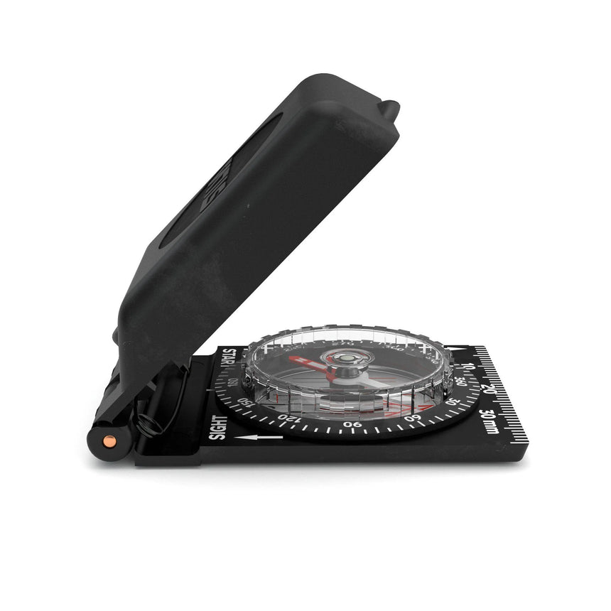 Black compass with a clear face on a white background