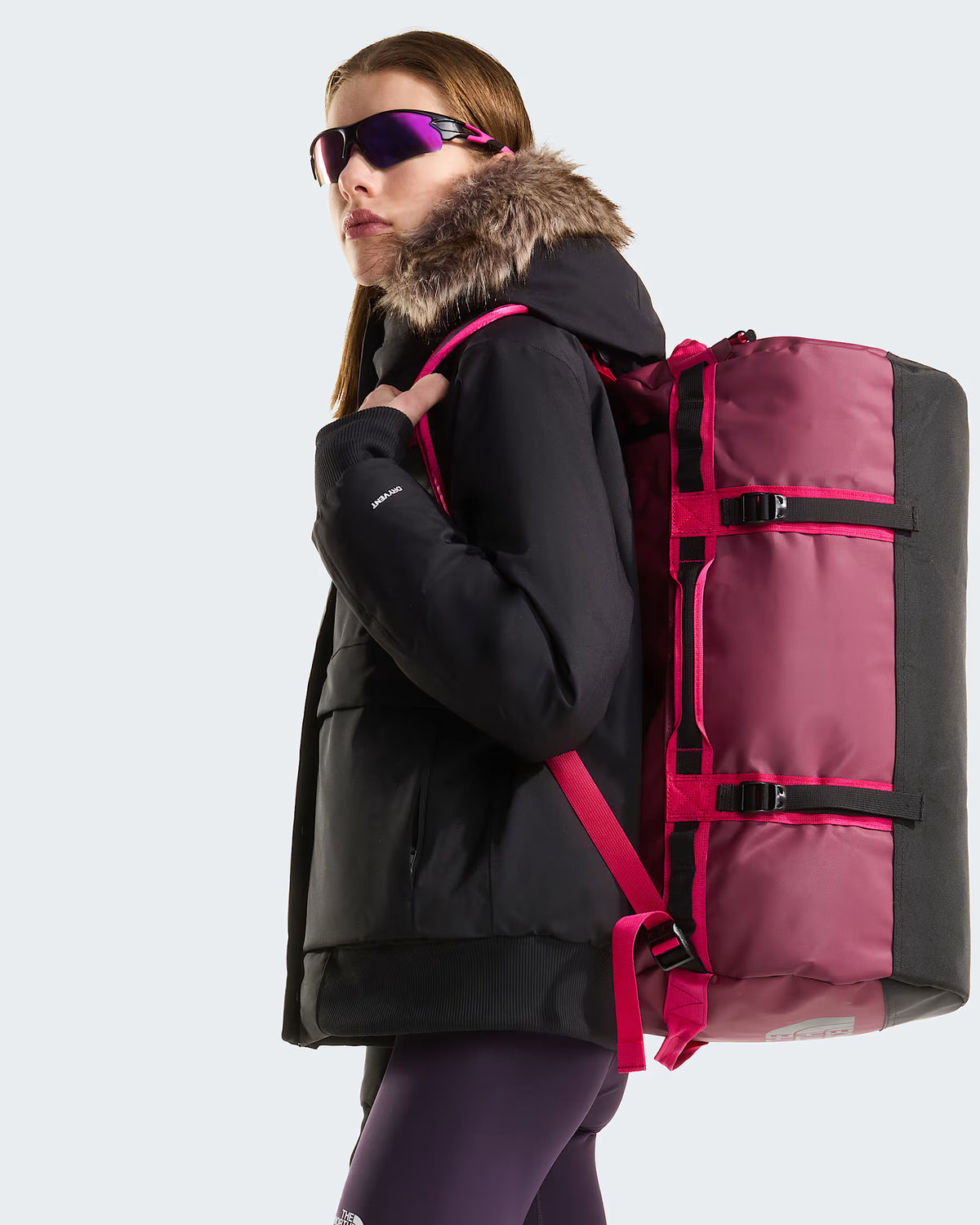 The North Face Base Camp Duffel - Small in Burgundy Crush/TNF Black - worn, back view