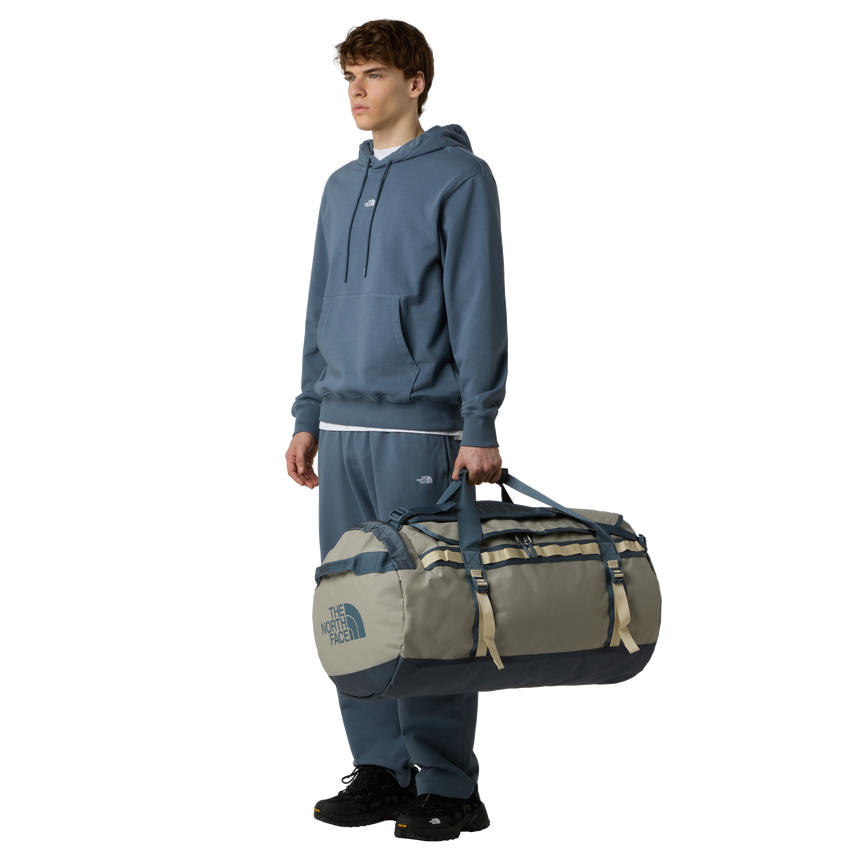 The North Face Base Camp Duffel Large Stone Slab/Gran - side view with detachable ergonomic shoulder straps and padded handles