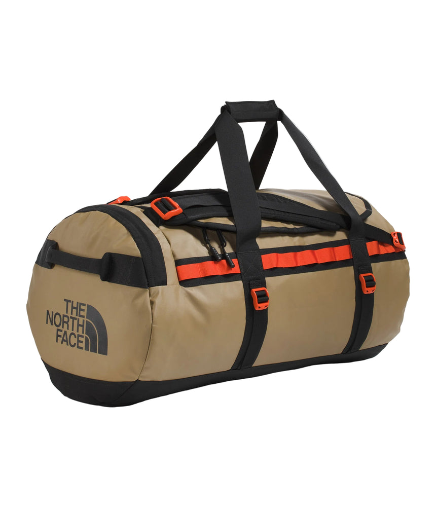 The North Face Base Camp Duffel Medium Cedar/TNF Black - lifestyle shot showing versatile backpack and duffel carry options