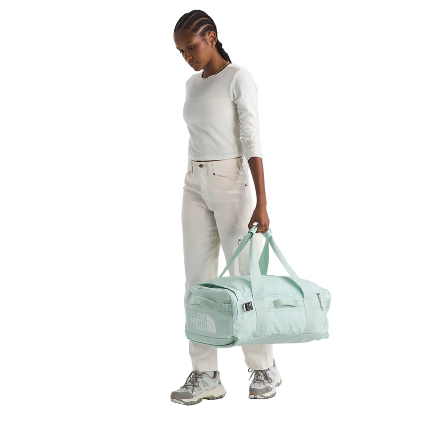 The North Face Base Camp Voyager Duffel 42L Opal Frost-Pearl/Stone White Model Holding Duffel