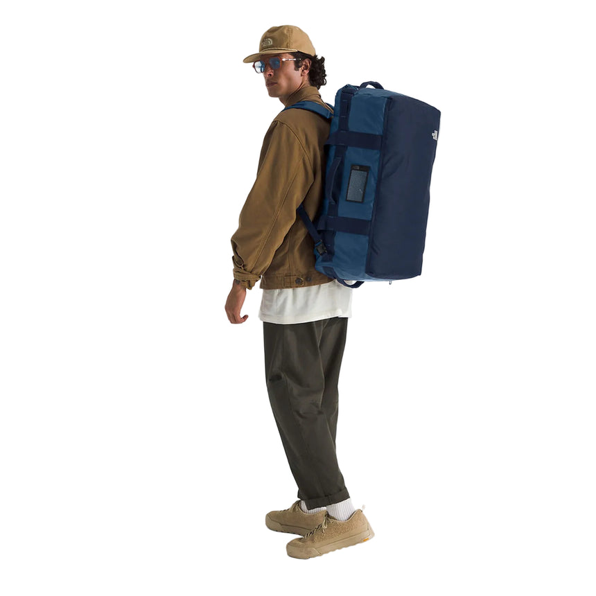 The North Face Base Camp Voyager Duffel 62L Shady Blue/Summit Navy Side Model Fit