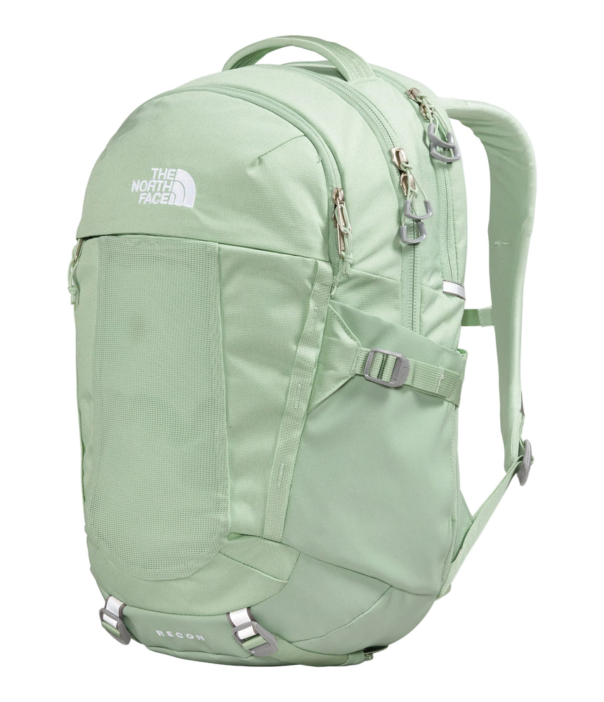 The North Face Women's Recon Backpack 30L Misty Sage Dark - lifestyle shot showing fleece-lined sunglasses pocket, sternum strap with whistle buckle and removable waist belt