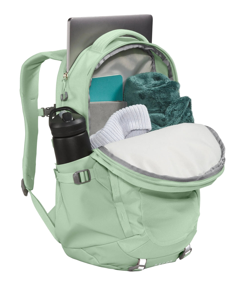 The North Face Women's Recon Backpack Misty Sage Dark - front compartment open showing padded tablet sleeve and internal organisation pockets