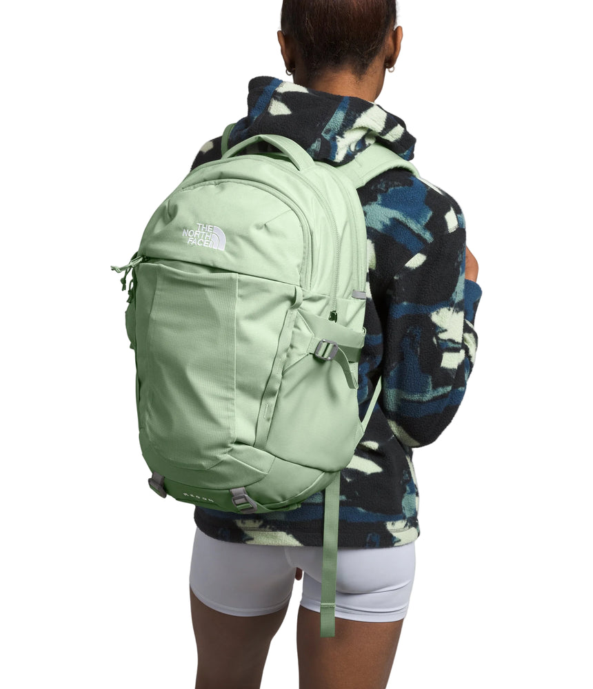 The North Face Women's Recon Backpack Misty Sage Dark - side view with dual water bottle pockets and external stretch-mesh pocket