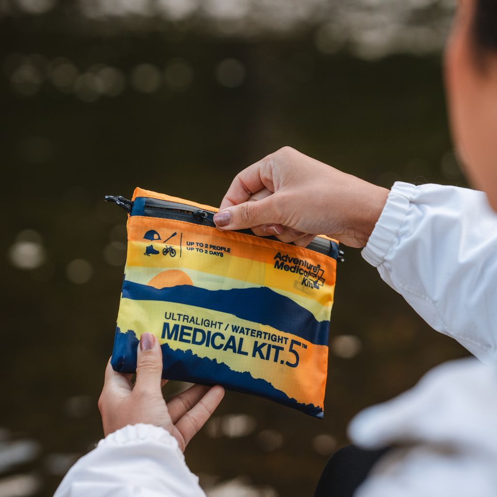 Adventure Medical Kits Ultralight Watertight .5 First Aid Kit held outdoors
