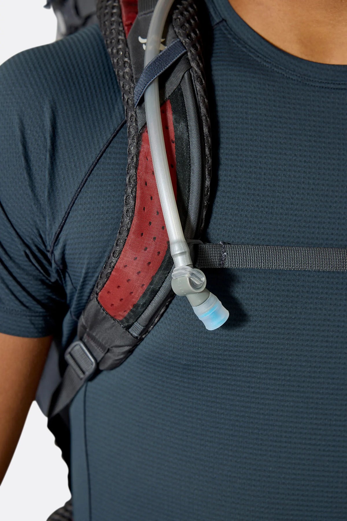 Rab Hyperon 65L Trekking Pack in Dark Pewter/Anthracite - hydration hose routing, worn