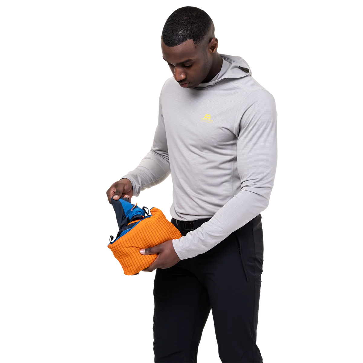 Mountain Equipment Aerotherm Men's Vest in Atlantic/Blue Nights - packed into hand pocket showing twin karabiner carry loops