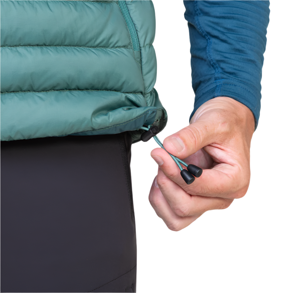 Mountain Equipment Earthrise Men's Vest in Fern packed into hand pocket showing twin karabiner carry loops
