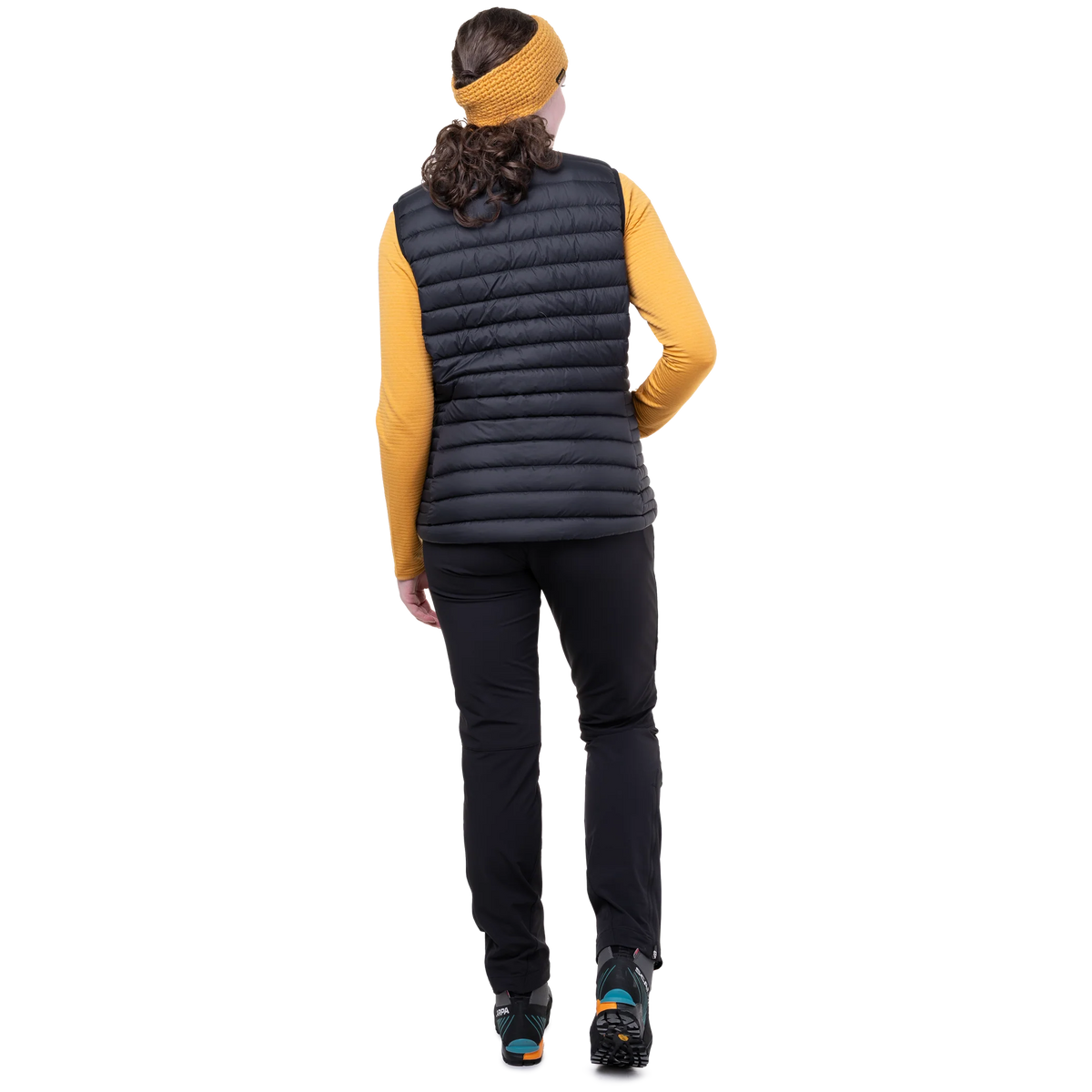 Mountain Equipment Earthrise Women's Vest in Black packed into hand pocket showing twin karabiner carry loops