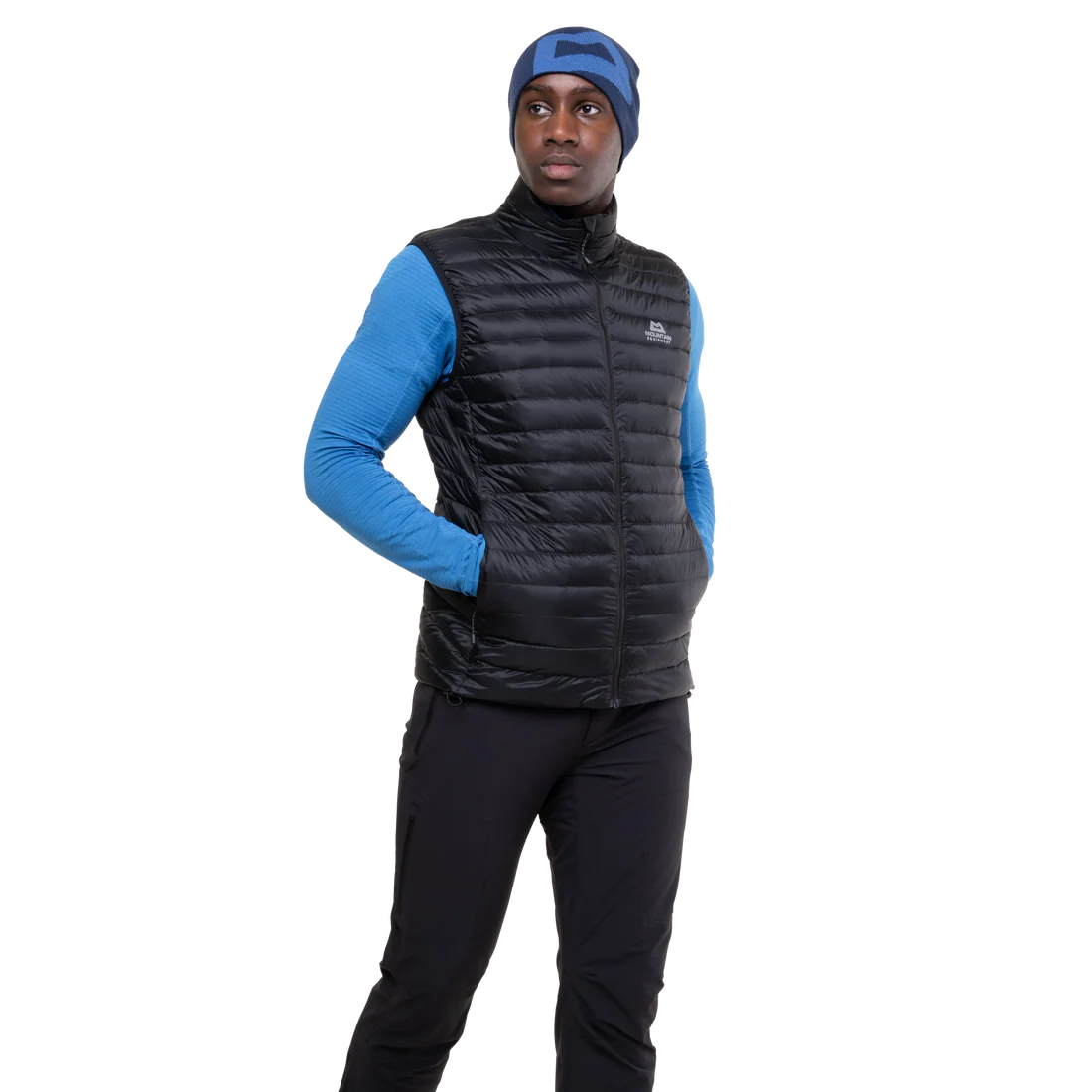 Mountain Equipment Frostline Men's Vest in Black worn on model - angled front view showing DRILITE Loft 20D shell and stitch-through narrow baffles