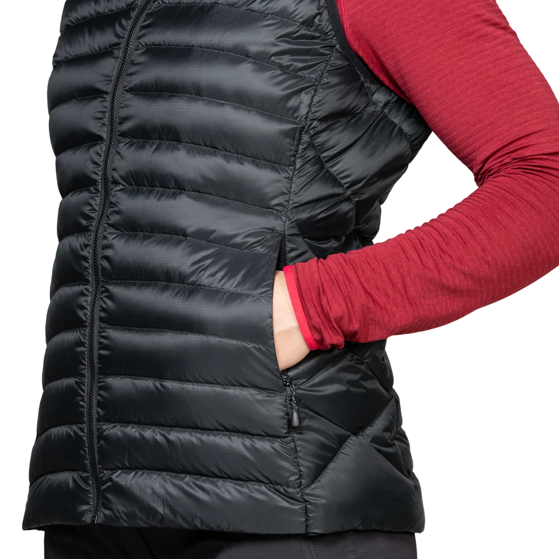 Zipped hand warmer pocket detail on Mountain Equipment Frostline Women's Vest in Black showing YKK zip and pack-away pocket with karabiner loops