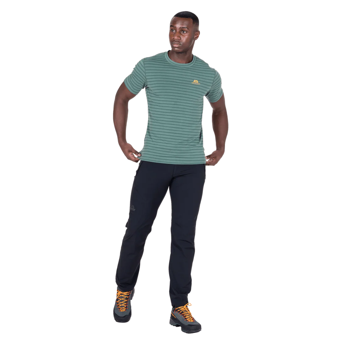 Mountain Equipment Groundup Men's Tee in Fern Stripe - lifestyle view showing lightweight technical tee for rock climbing on hot days