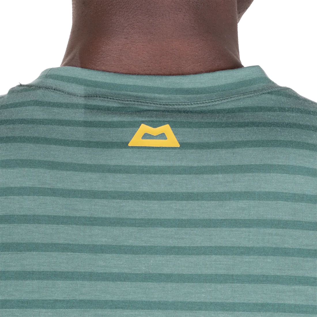 Mountain Equipment Groundup Men's Tee in Fern Stripe - lifestyle view showing fast-drying stretchy tee for mountain walking and trekking