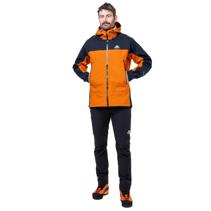 Mountain Equipment Saltoro GORE-TEX Men's Jacket in Rust/Cosmos - back view showing dropped rear hem and articulated pre-shaped sleeves