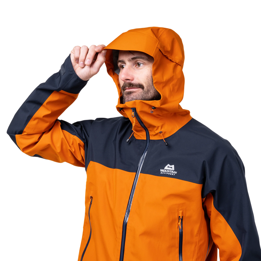 Mountain Equipment Saltoro GORE-TEX Men's Jacket in Rust/Cosmos - lifestyle view showing waterproof shell for trekking and alpine mountaineering