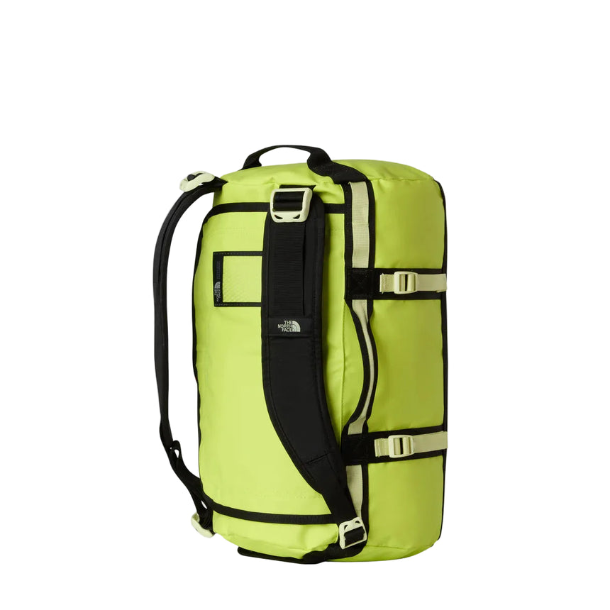 The North Face Base Camp Duffel Extra Small Fizz Lime/Lemon Mist/TNF Black - lifestyle shot showing versatile backpack and duffel carry options