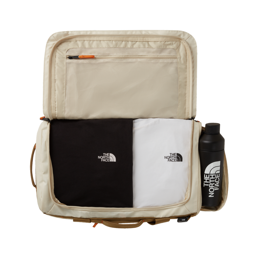 The North Face Base Camp Voyager Duffel 42L Desert Stone/Cedar/Desert Rust - side view with detachable padded shoulder straps and grab handles