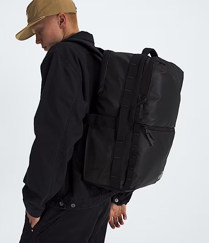 The North Face Base Camp Voyager Travel Pack 35L Black/Asphalt Grey - main compartment open showing adjustable divider and fillet zipper for full access
