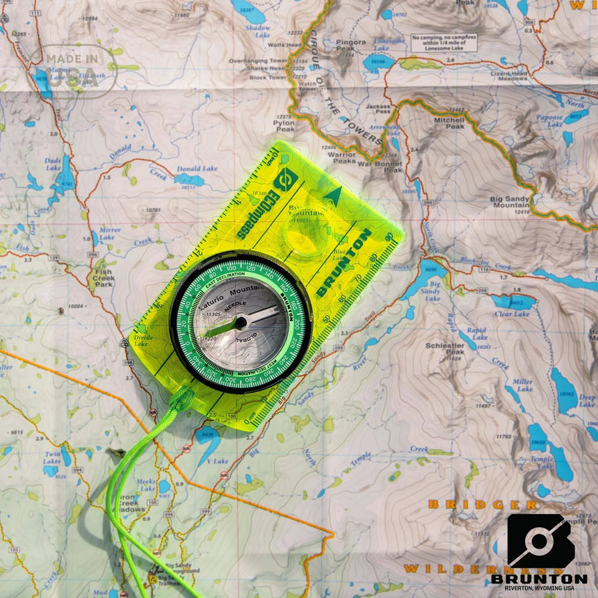Brunton compass on a topographic map