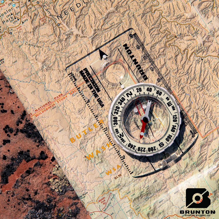 Brunton compass on a topographic map