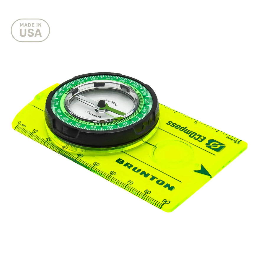 Brunton compass on a white background