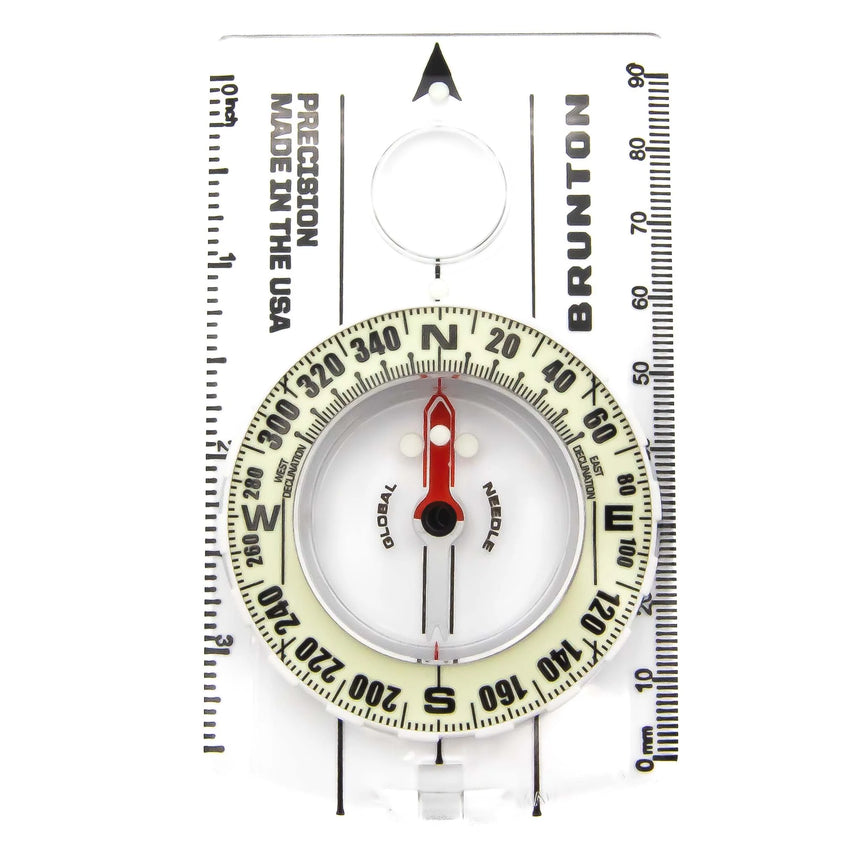 Brunton compass with scale on a white background