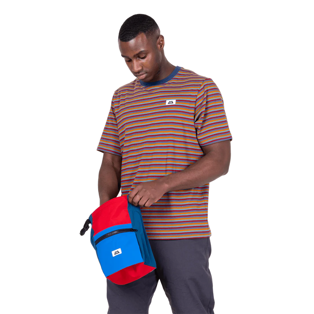 Mountain Equipment Lava Men's Tee in Stanage Stripe - Three quarter view with bag