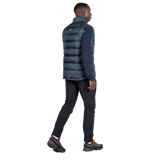 Mountain Equipment Lightline Men's Vest in Blue Nights - back view on model showing stitch-through baffle construction and dual tether hem drawcords
