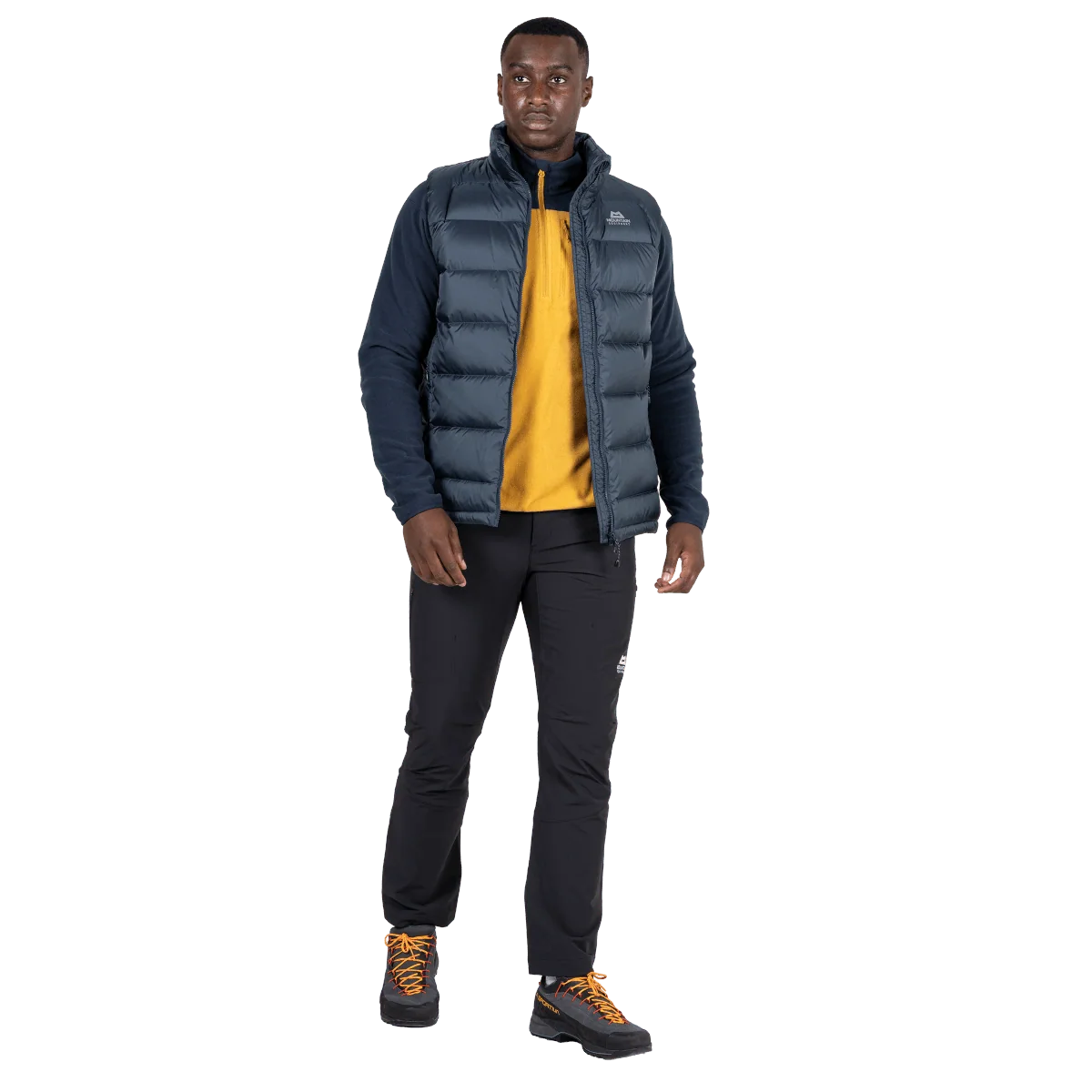 Mountain Equipment Lightline Men's Vest in Blue Nights - side view on model showing 700 fill power down insulation and low bulk active fit