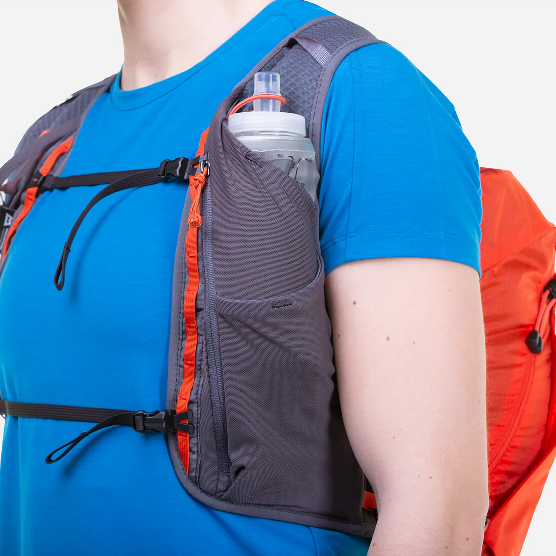 Mountain Equipment Tupilak 14 Vest Pack in Magma - Side Bottle Pocket on Model