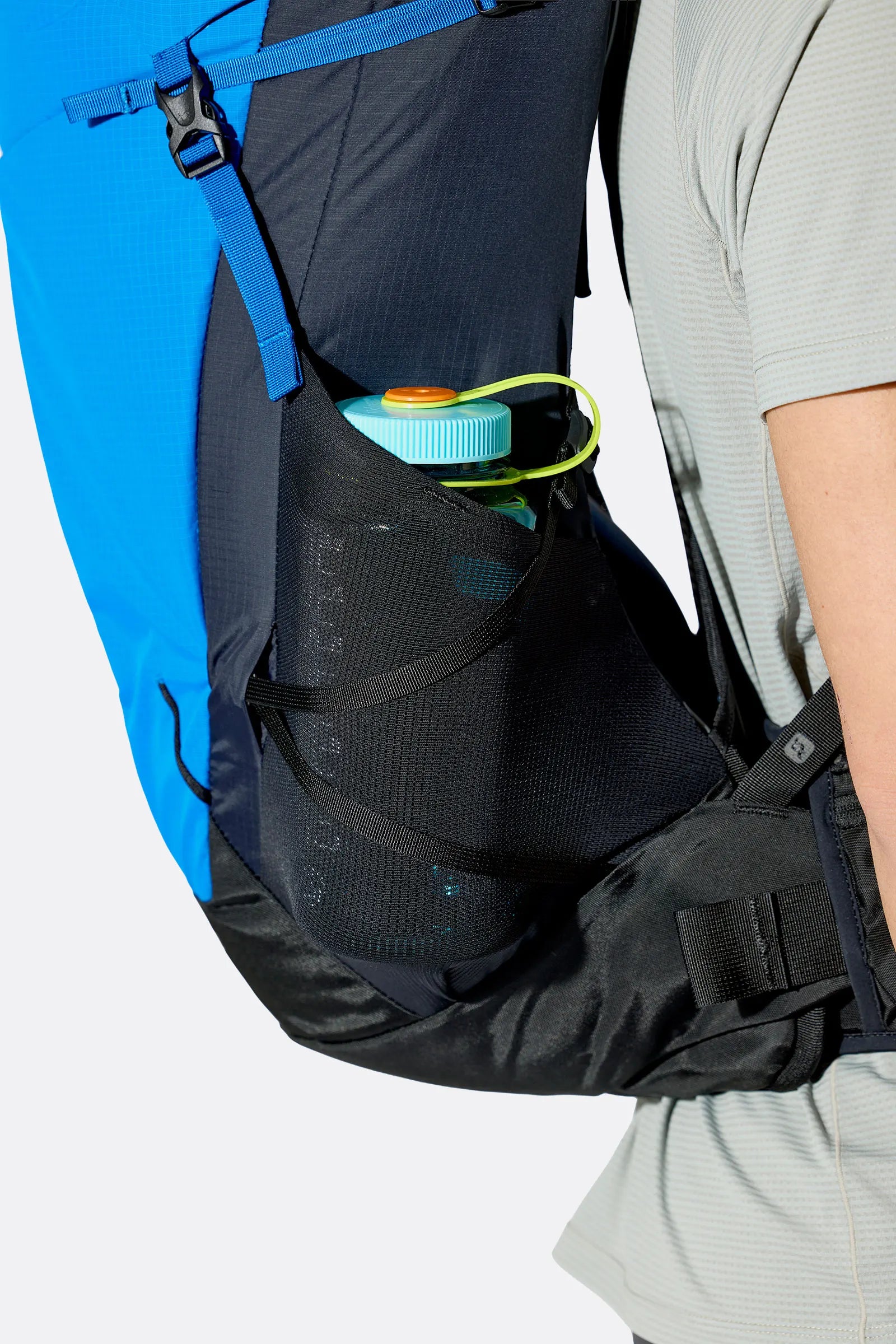 Rab Airox 30 Day Pack in Maya Blue/Black - Side View On Model