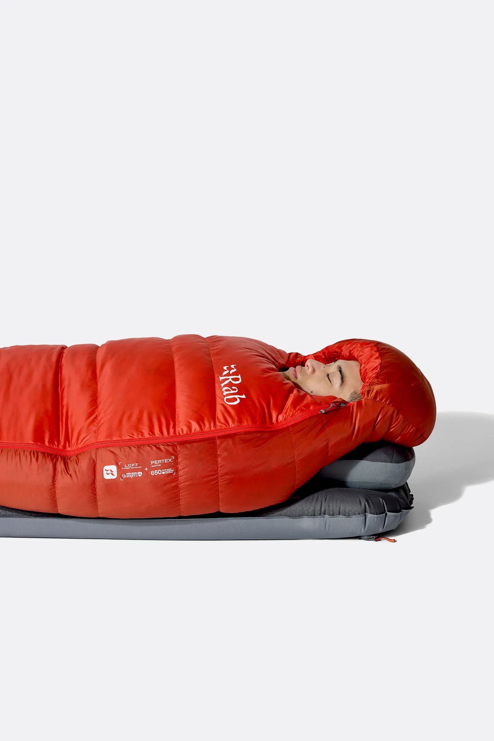Rab Alpine Down Sleeping Bag (-12°C/10F) in Dark Horizon/Tuscan Red - worn, side sleeping