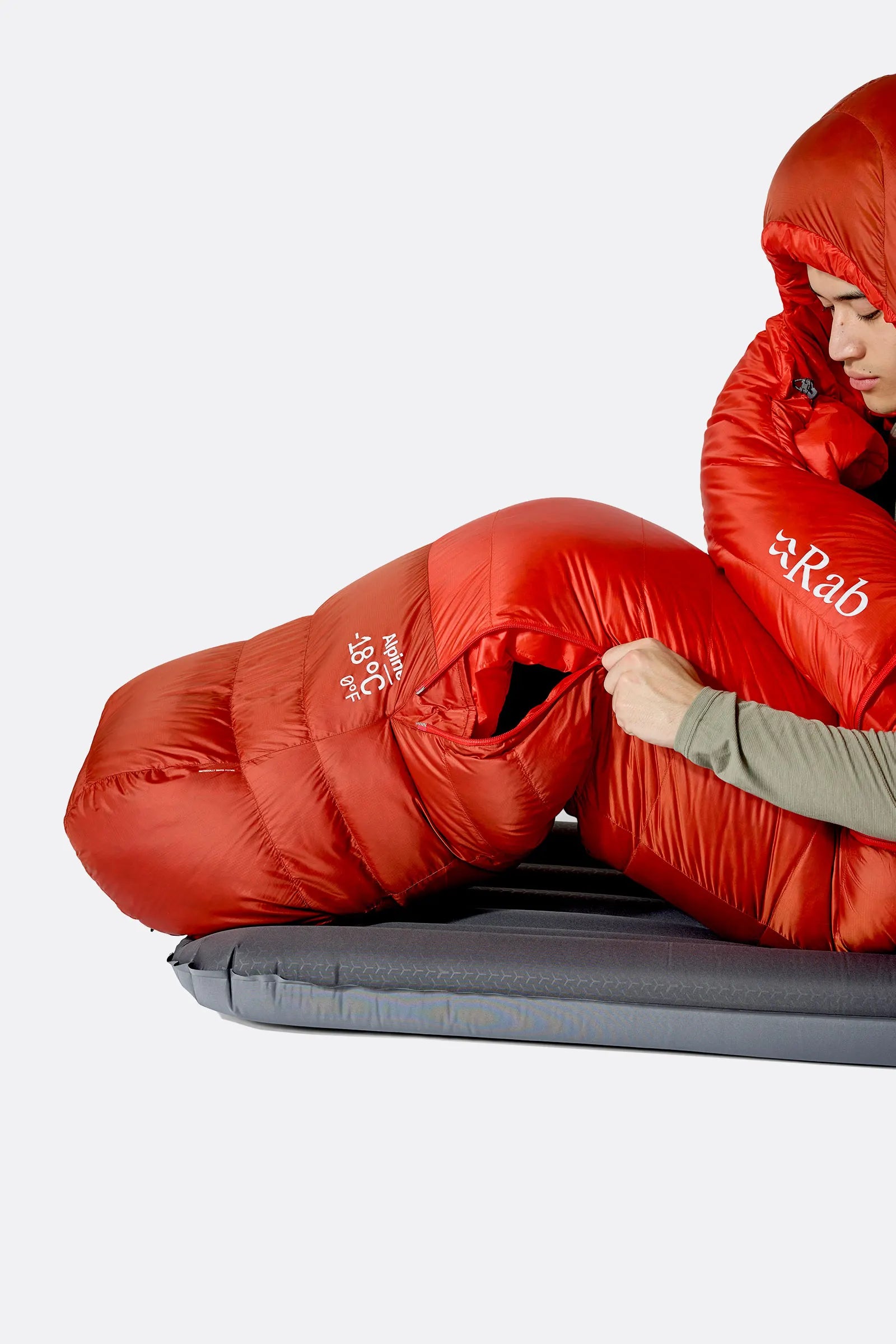 Rab Alpine Down Sleeping Bag (-6°C/21F) in Dark Horizon/Tuscan Red - worn, side sleeping