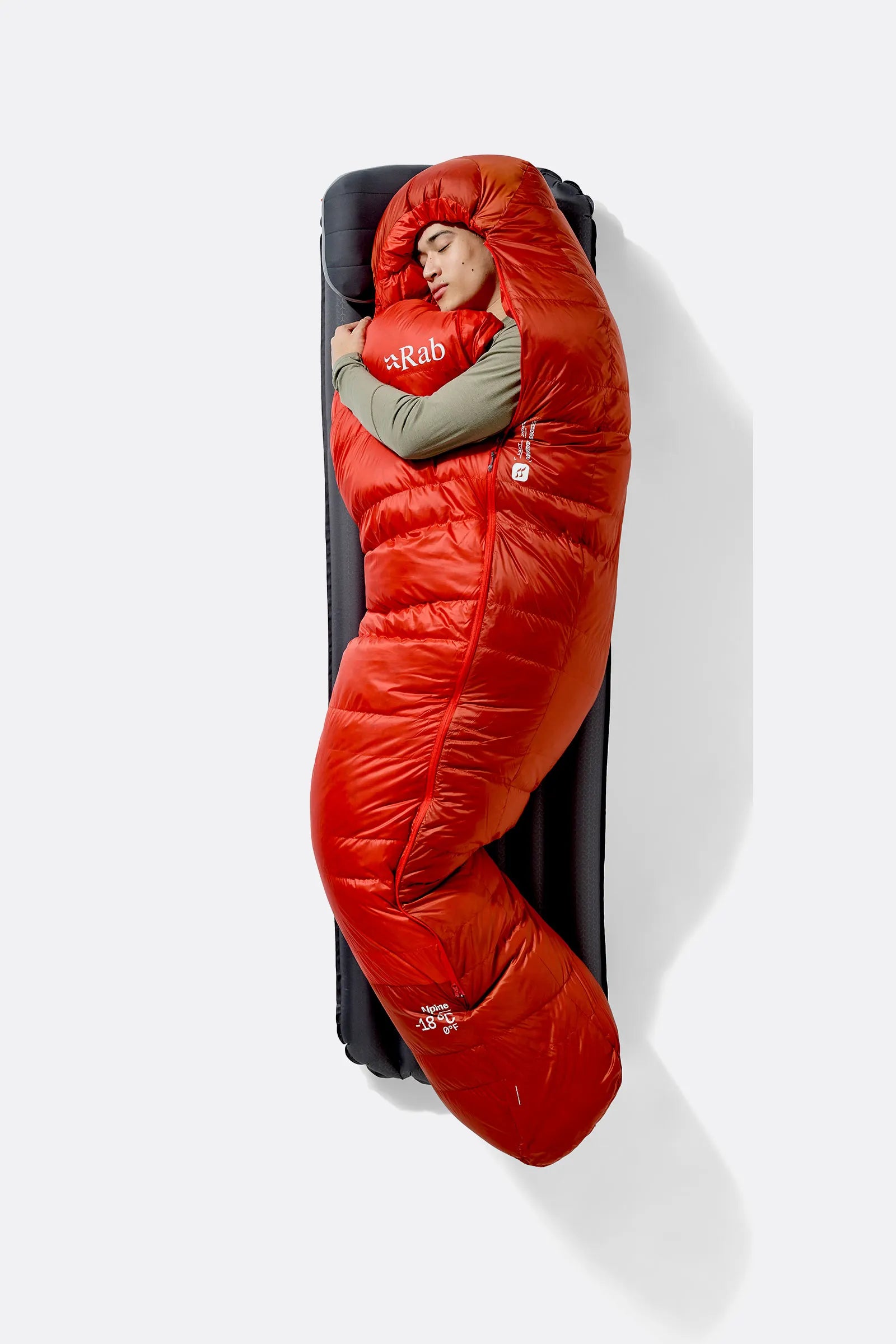 Rab Alpine Down Sleeping Bag (-6°C/21F) in Dark Horizon/Tuscan Red - worn, side sleeping