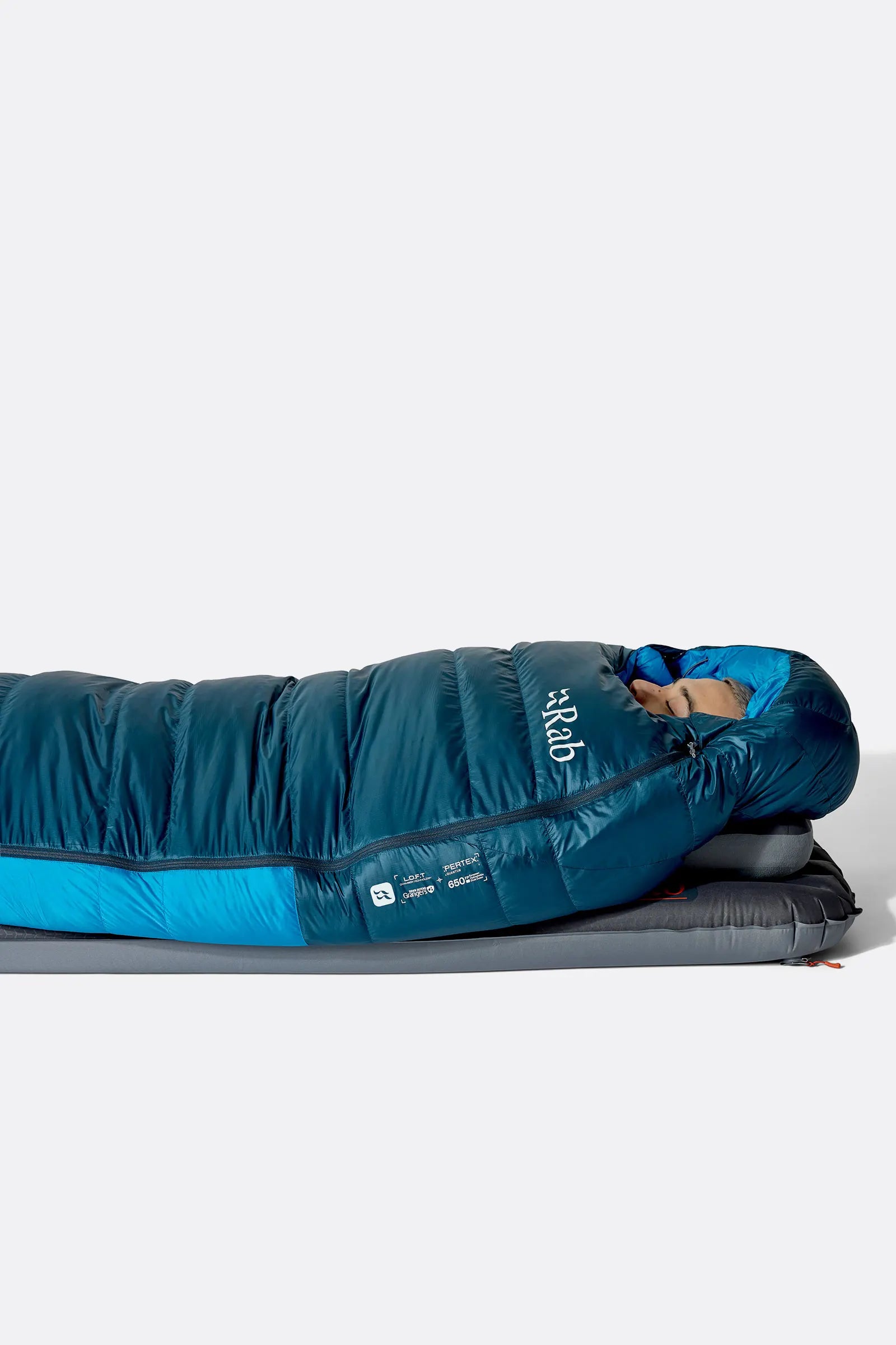 Rab Ascent Down Sleeping Bag (-18°C/0F) in Tempest Blue/Maya Blue - Model Lying Flat