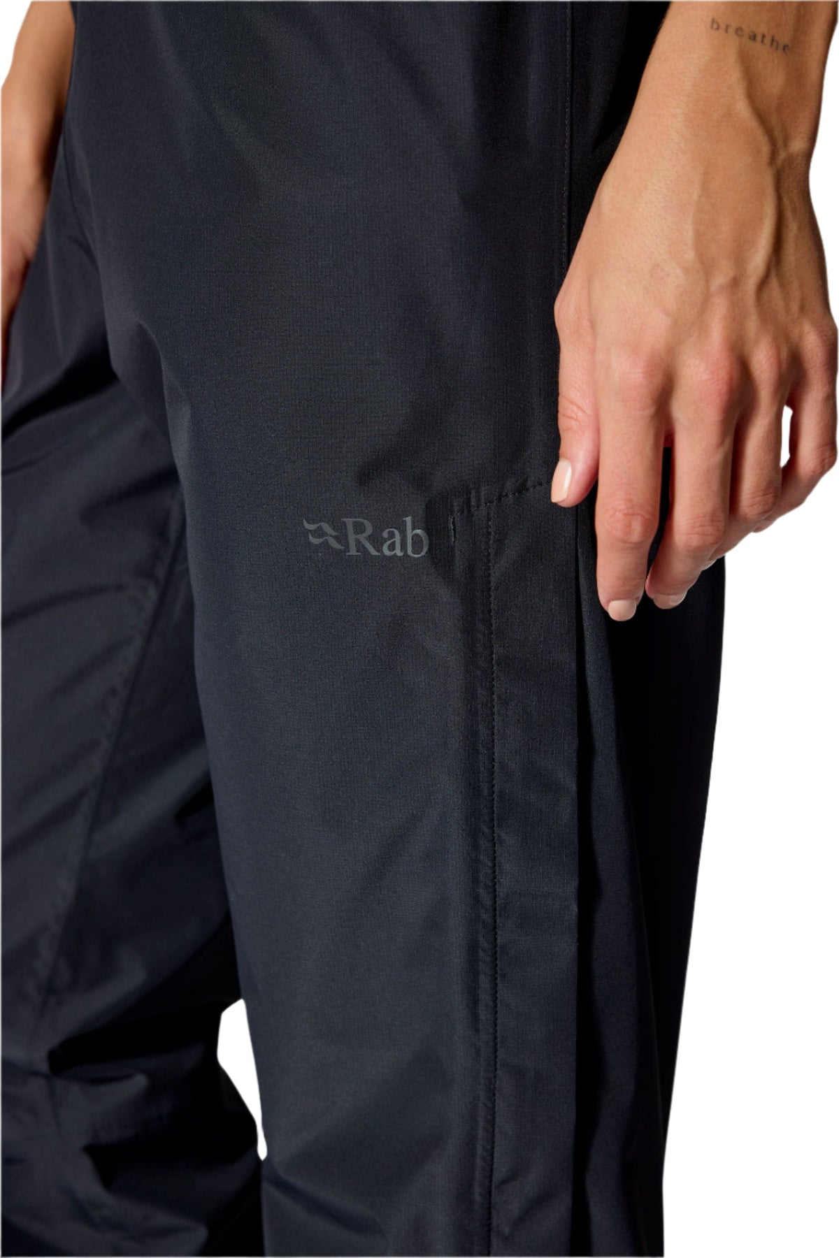 Rab Women's Downpour Waterproof Pants in Black - side zip detail, lower leg, worn