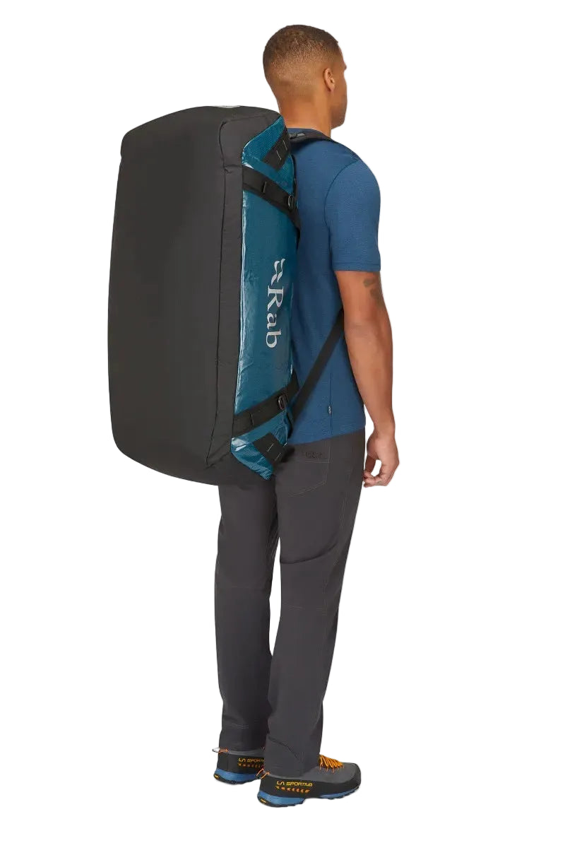 Rab Expedition II 120L Kitbag in Blue - Model Carrying as Duffel Front View