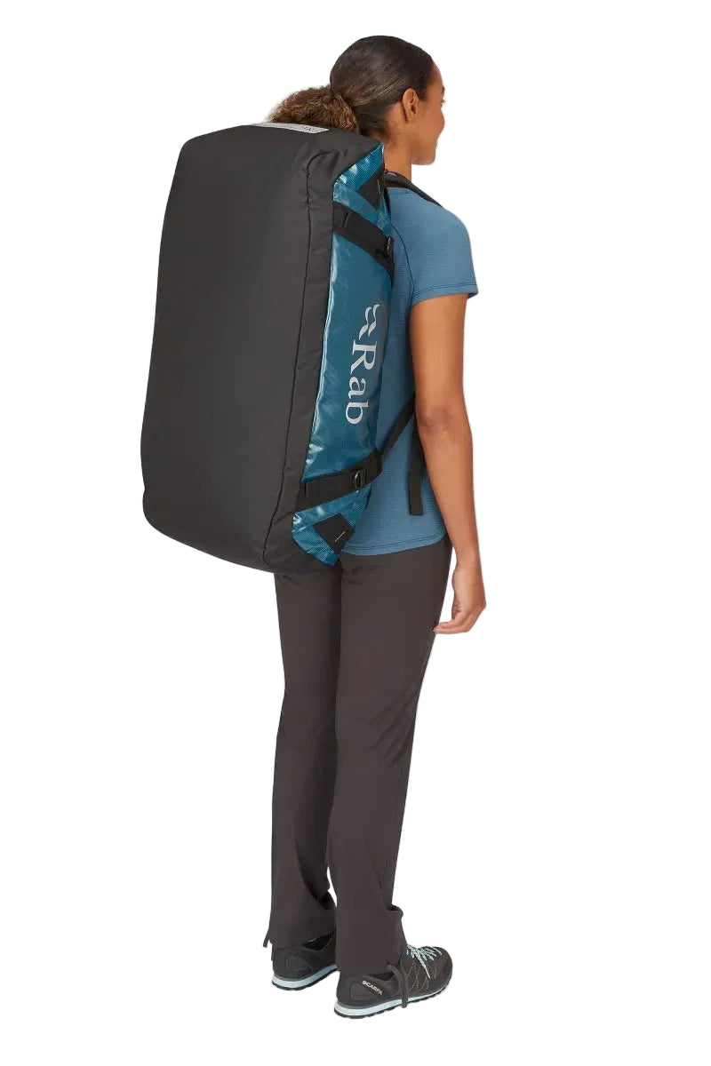 Rab Expedition II 80L Kitbag in Blue - Model Wearing as Backpack Side View Alternative