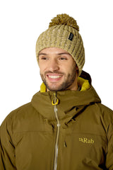 Rab Kharve Bobble Beanie in Dark Pollen/Pebble - worn, front