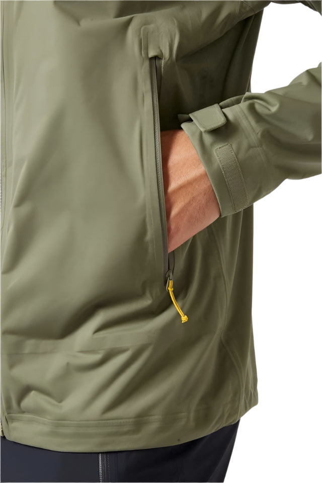 Rab Men's Kinetic 2.0 Waterproof Jacket in Green (styling reference) - pocket detail, worn